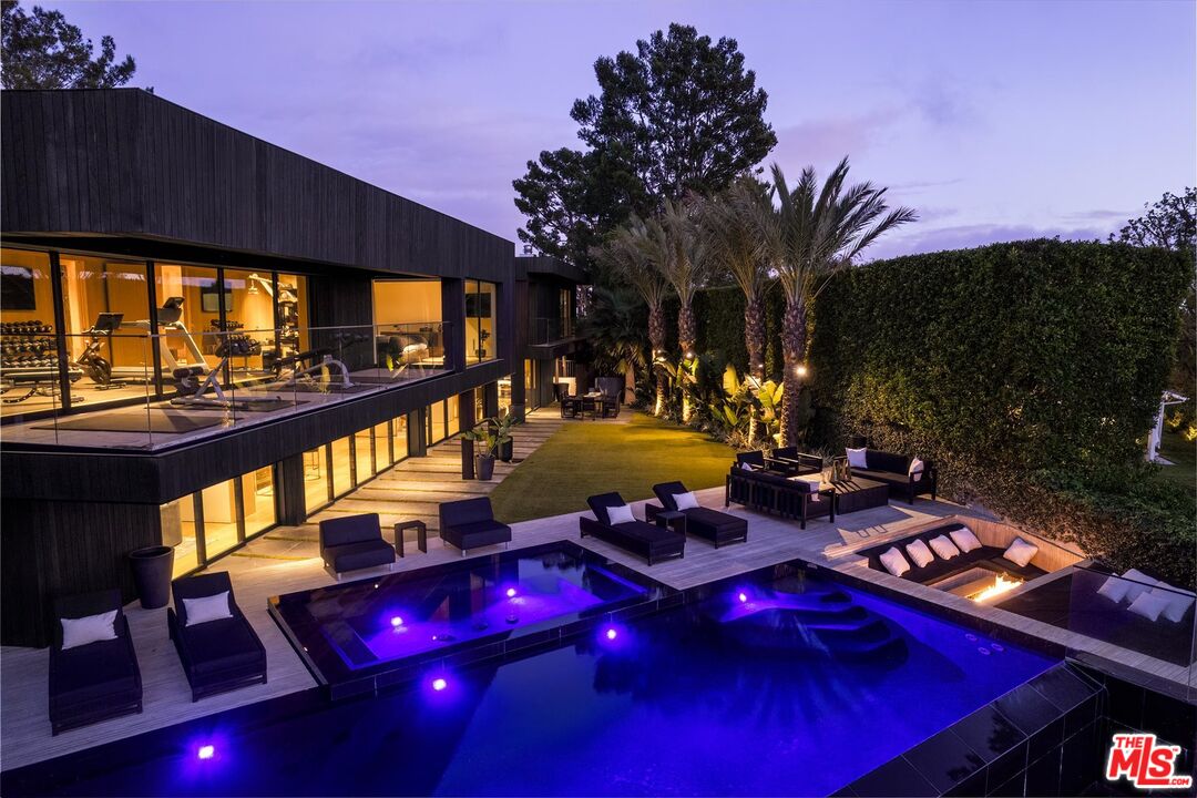 1663 Summitridge Drive Beverly Hills, CA 90210 - Photo 22 of 22 a view of a swimming pool with a patio