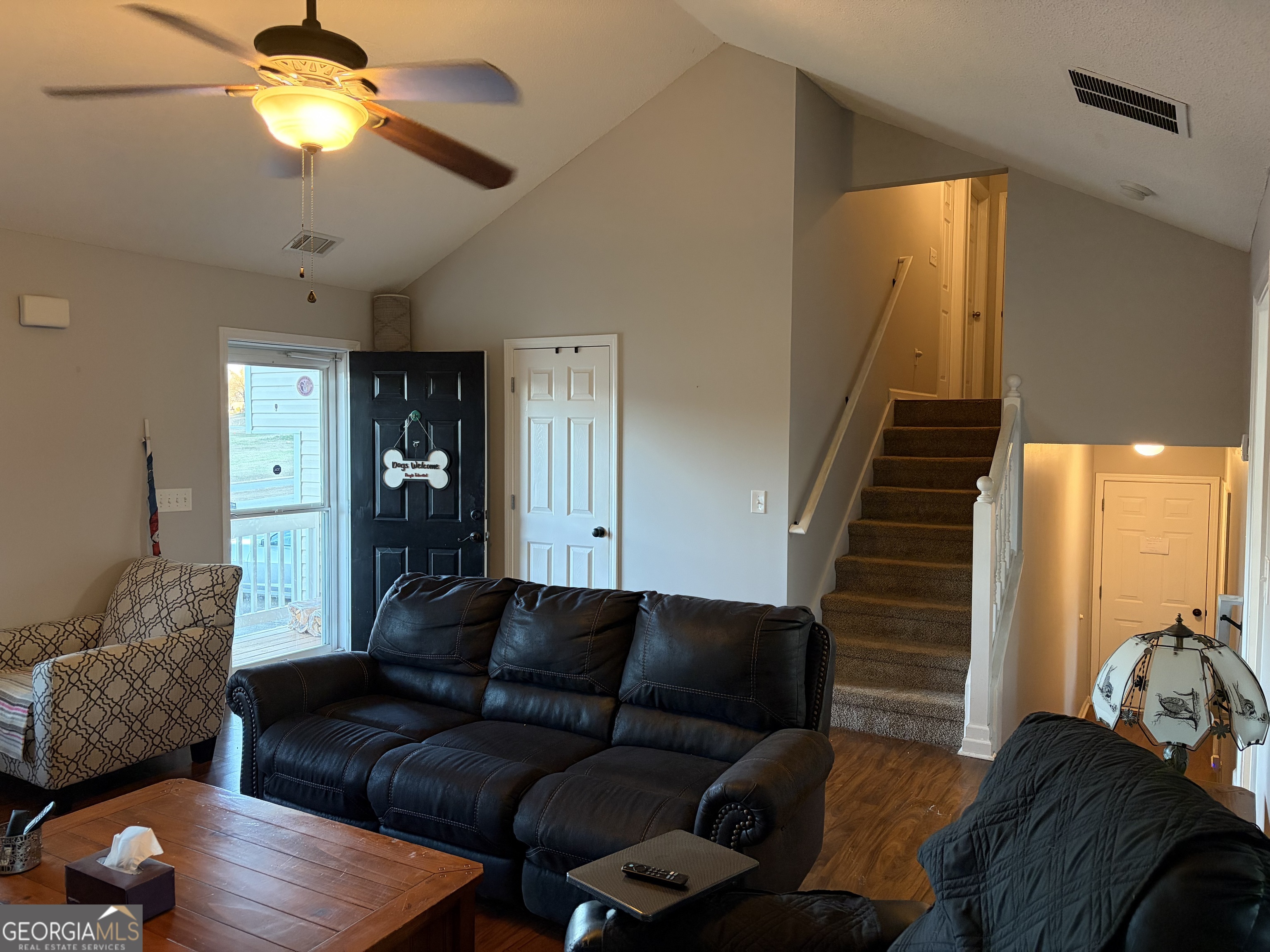 137 Stonebrooke Drive Colbert, GA 30628 - Photo 19 of 47 a living room with furniture and a chandelier