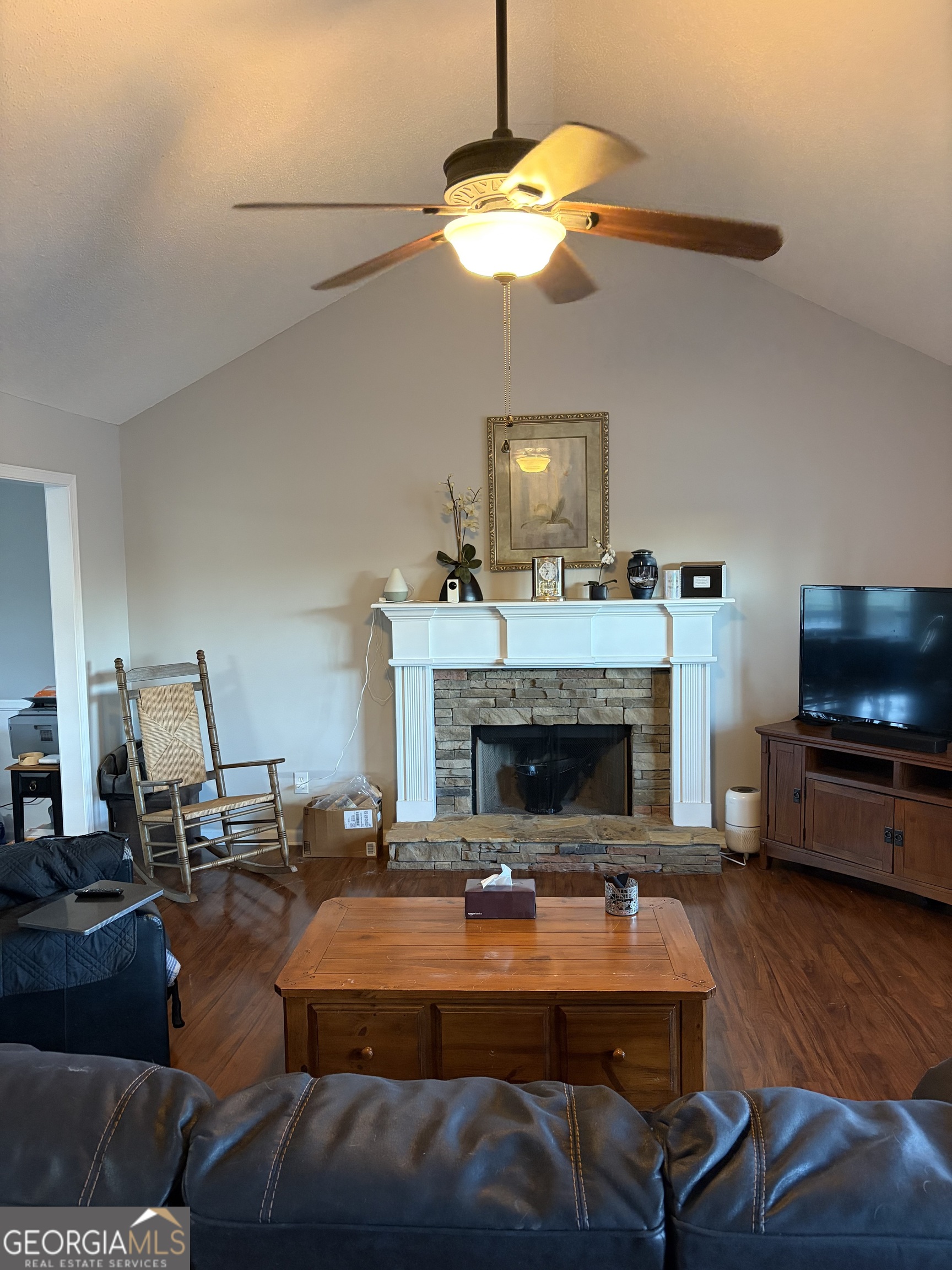 137 Stonebrooke Drive Colbert, GA 30628 - Photo 20 of 47 a living room with furniture a flat screen tv and kitchen view