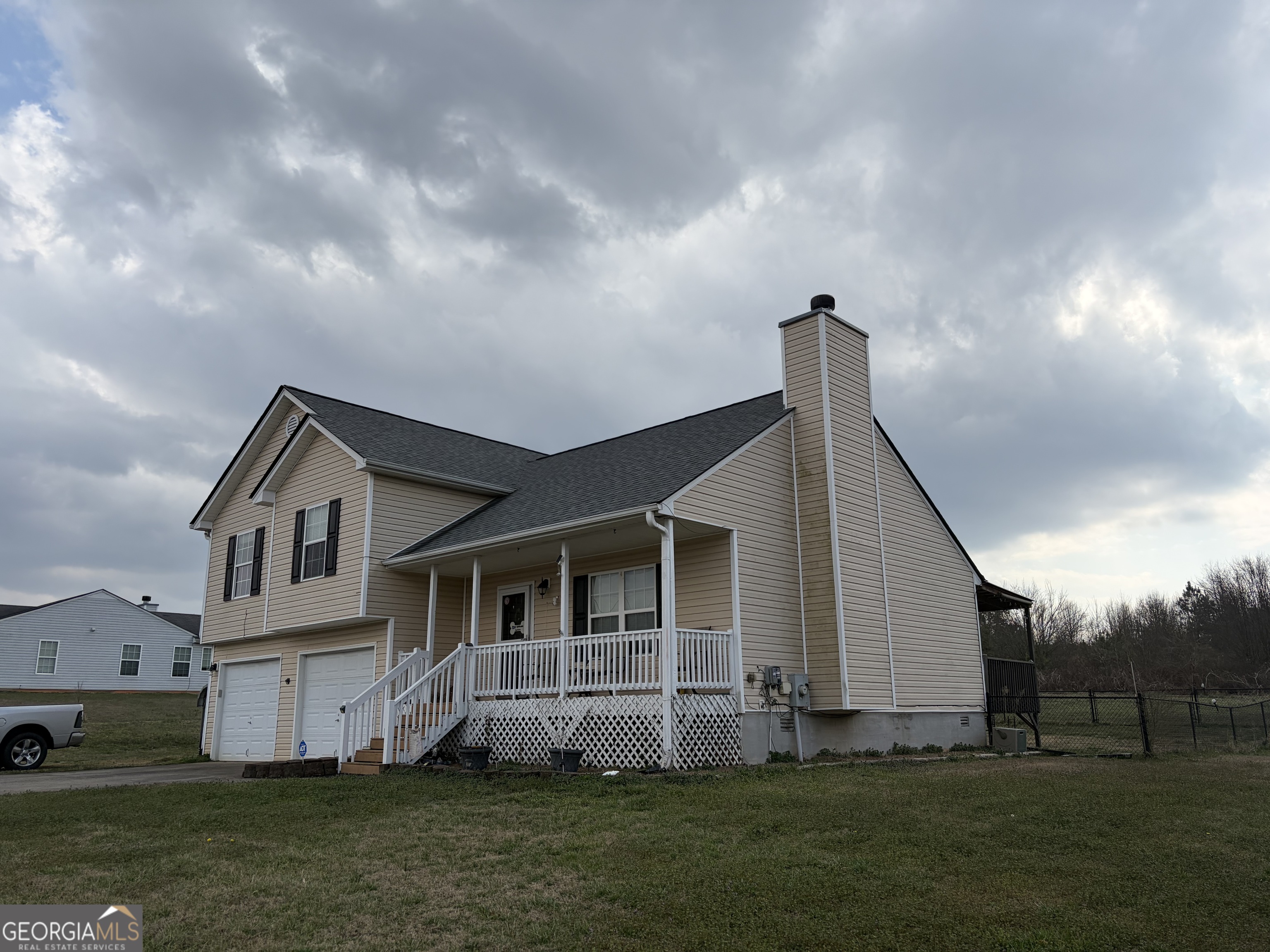 137 Stonebrooke Drive Colbert, GA 30628 - Photo 2 of 47 a front view of a house with a garden