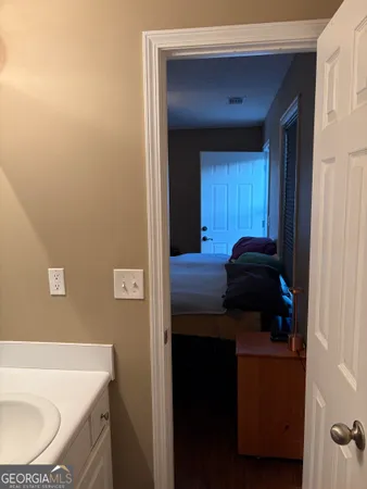a bathroom with a sink a vanity and a bathtub