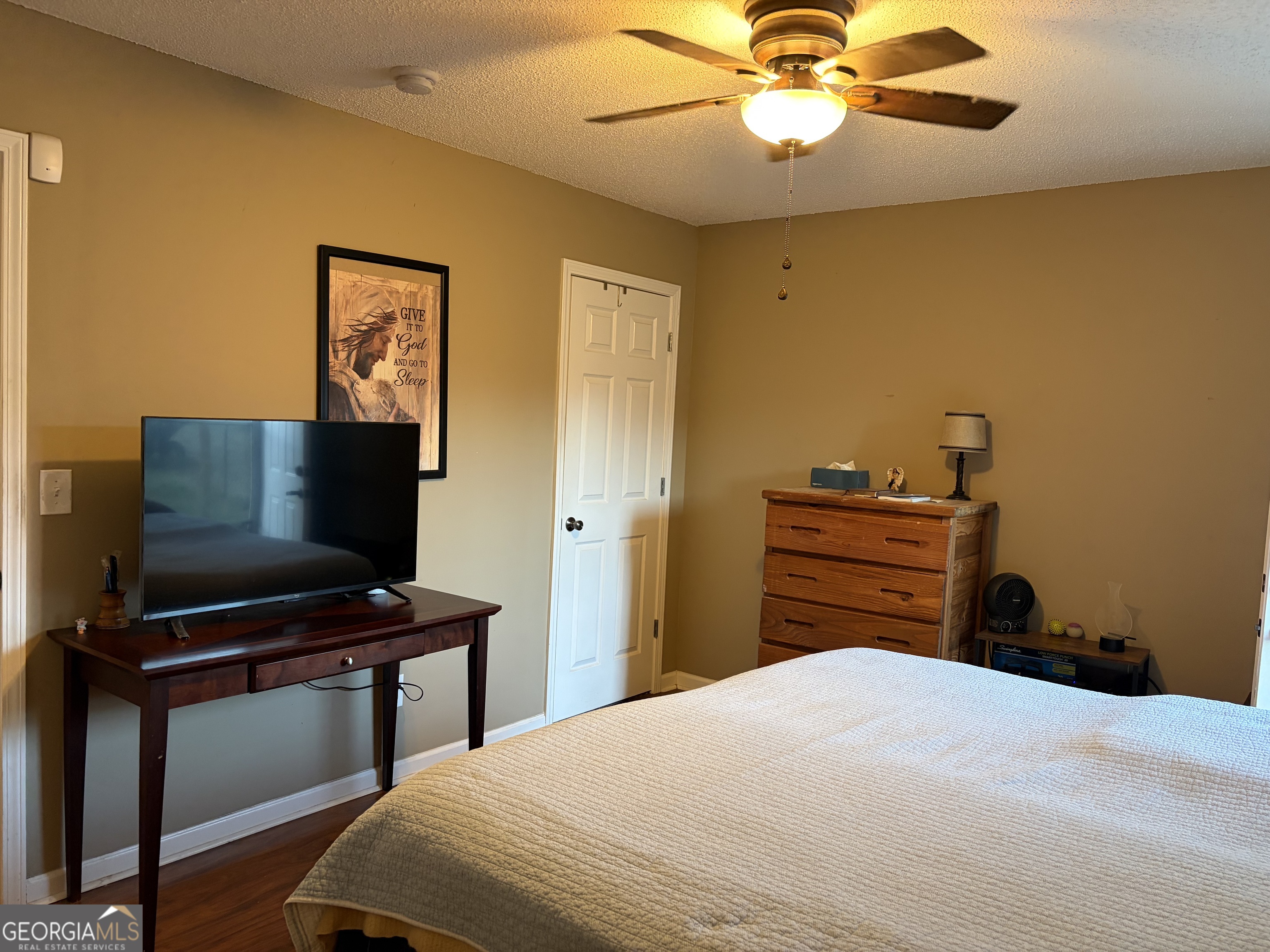 137 Stonebrooke Drive Colbert, GA 30628 - Photo 27 of 47 a bedroom with a bed and a flat screen tv