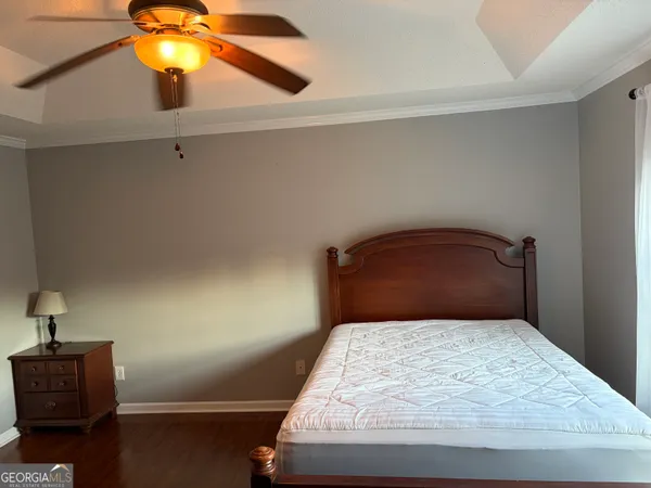 a bedroom with a bed and window