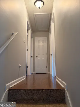 a view of entryway with wooden floor