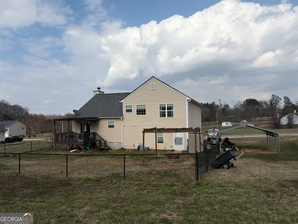 a view of house with outdoor space