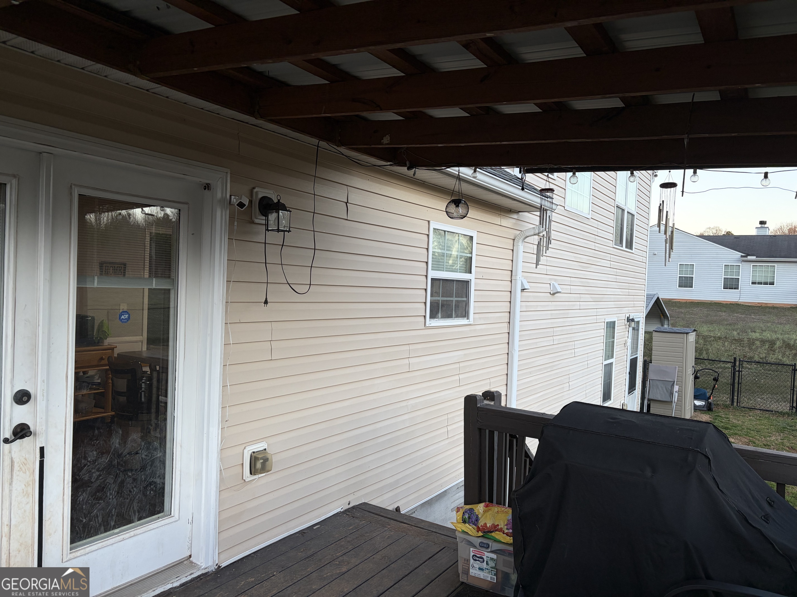 137 Stonebrooke Drive Colbert, GA 30628 - Photo 8 of 47 a view of a porch with furniture and wooden floor