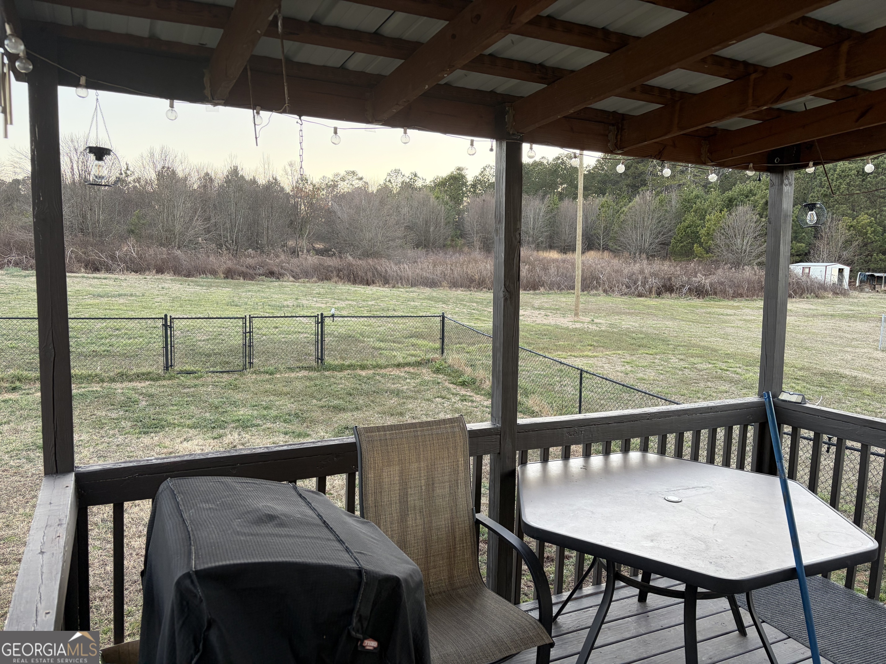 137 Stonebrooke Drive Colbert, GA 30628 - Photo 9 of 47 a view of a porch with furniture and wooden deck