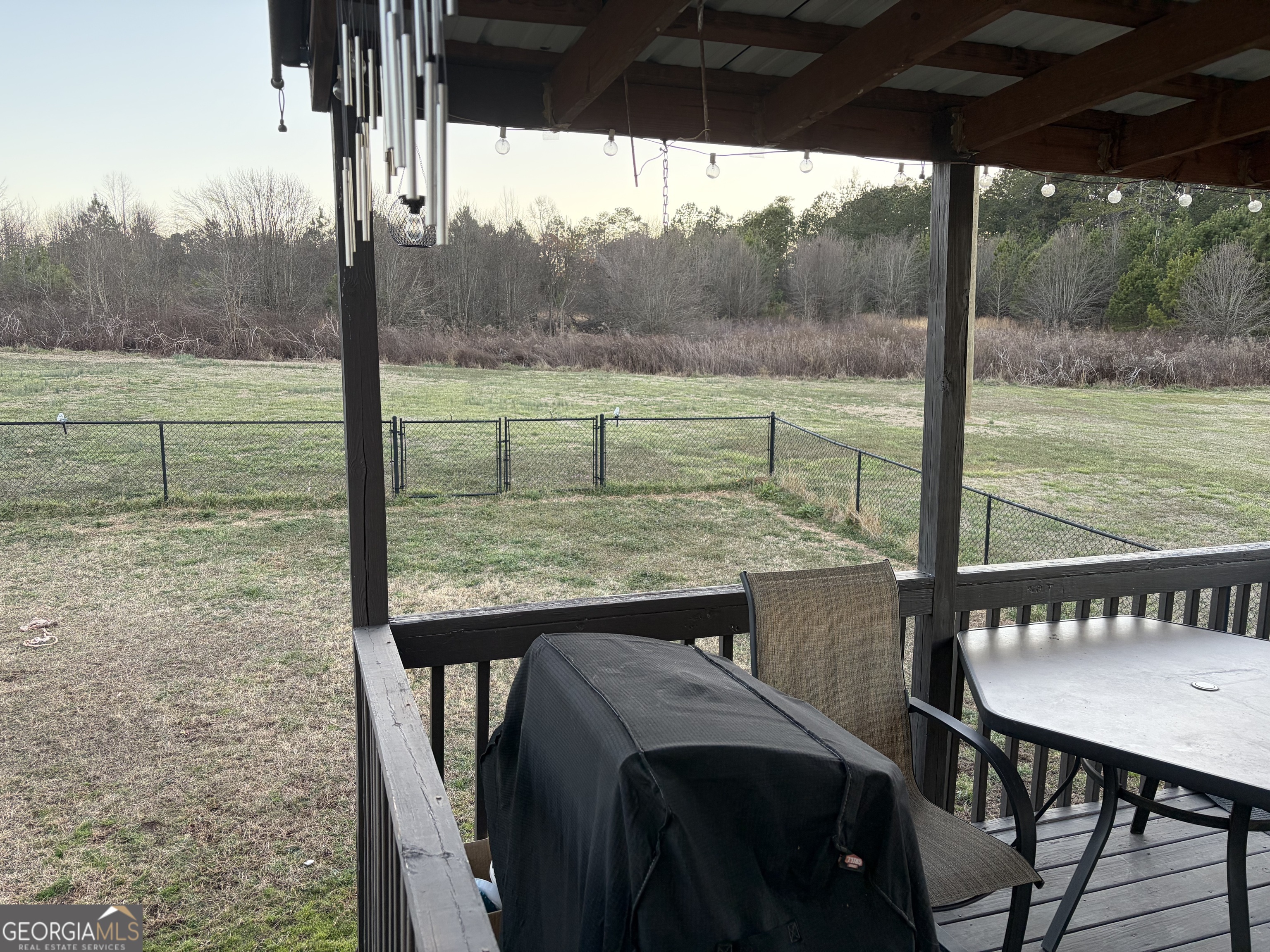 137 Stonebrooke Drive Colbert, GA 30628 - Photo 10 of 47 a view of a wooden deck and a backyard
