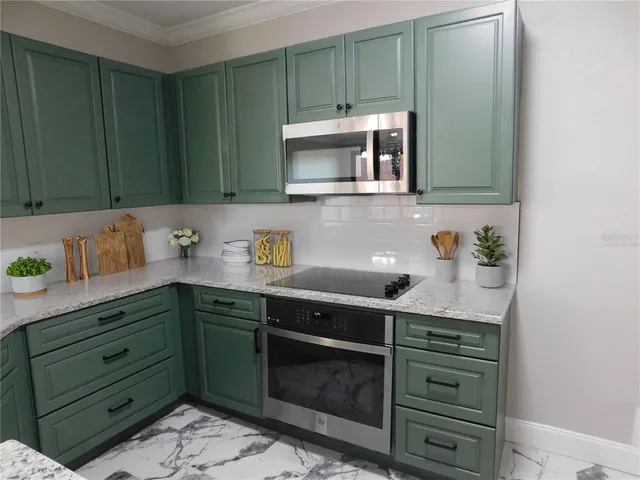 a kitchen with a sink and cabinets