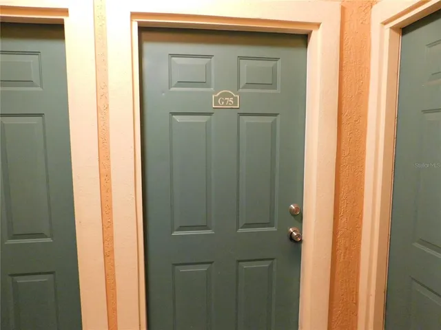 a bathroom with a glass door