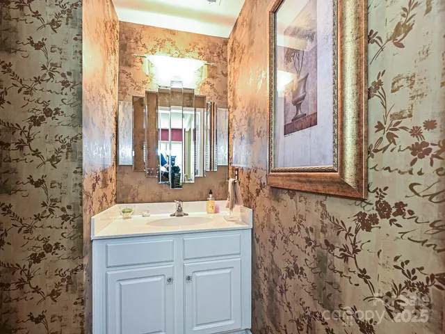 a bedroom with a bed couch and a window