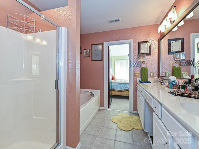a bathroom with a bathtub and shower