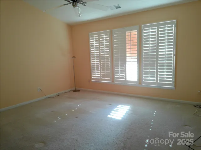 a spacious bathroom with a sink double vanity and a mirror