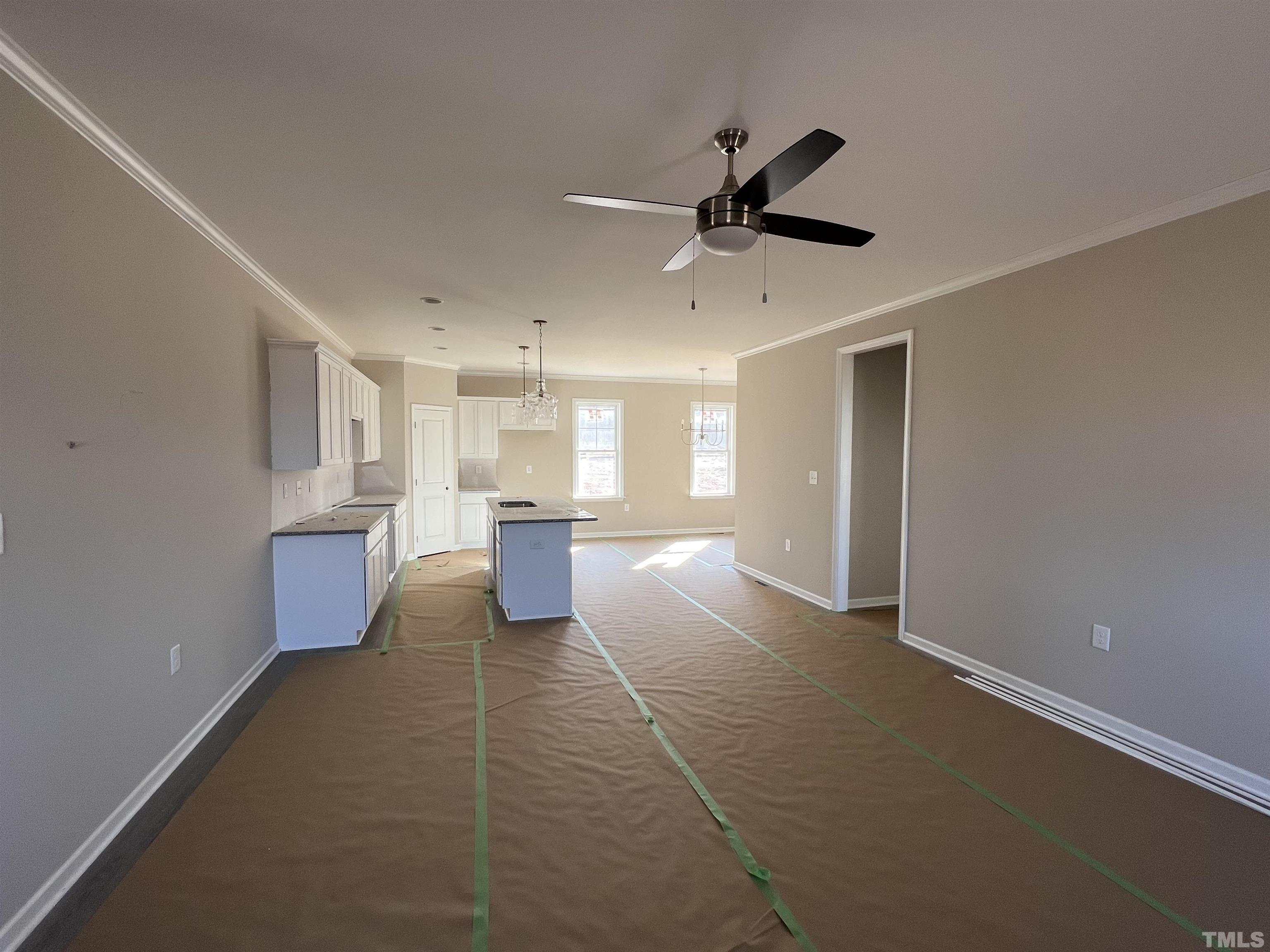 4526 Debnam Road Zebulon, NC 27597 - Photo 6 of 6 a view of a kitchen with furniture and a ceiling fan
