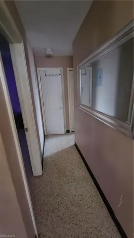 a view of a hallway with staircase