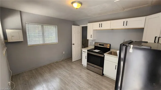 a kitchen with a stove and a refrigerator