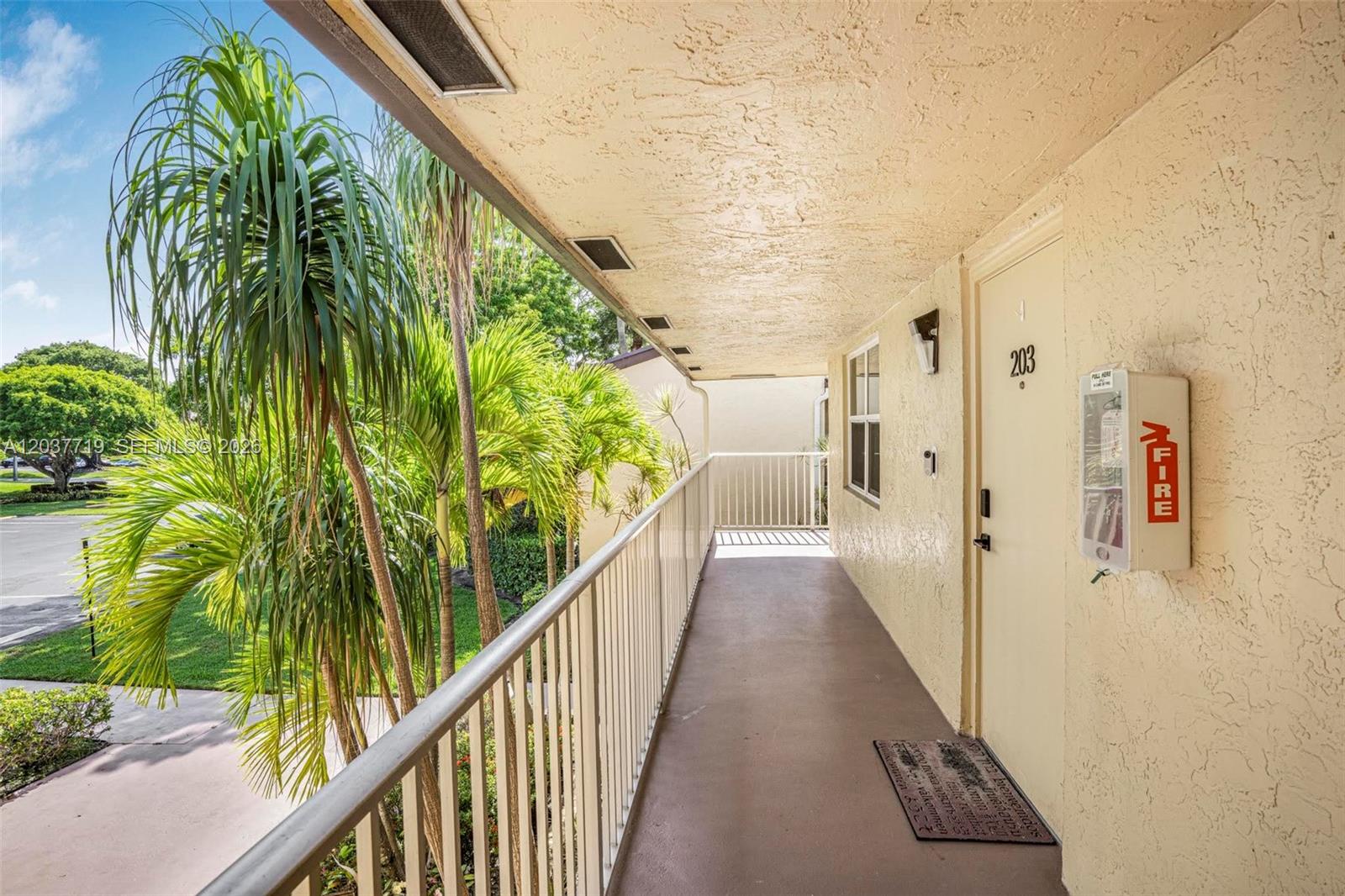 8770 Azalea Court, Unit 203 Tamarac, FL 33321 - Photo 30 of 33 2nd Floor Exterior Catwalk