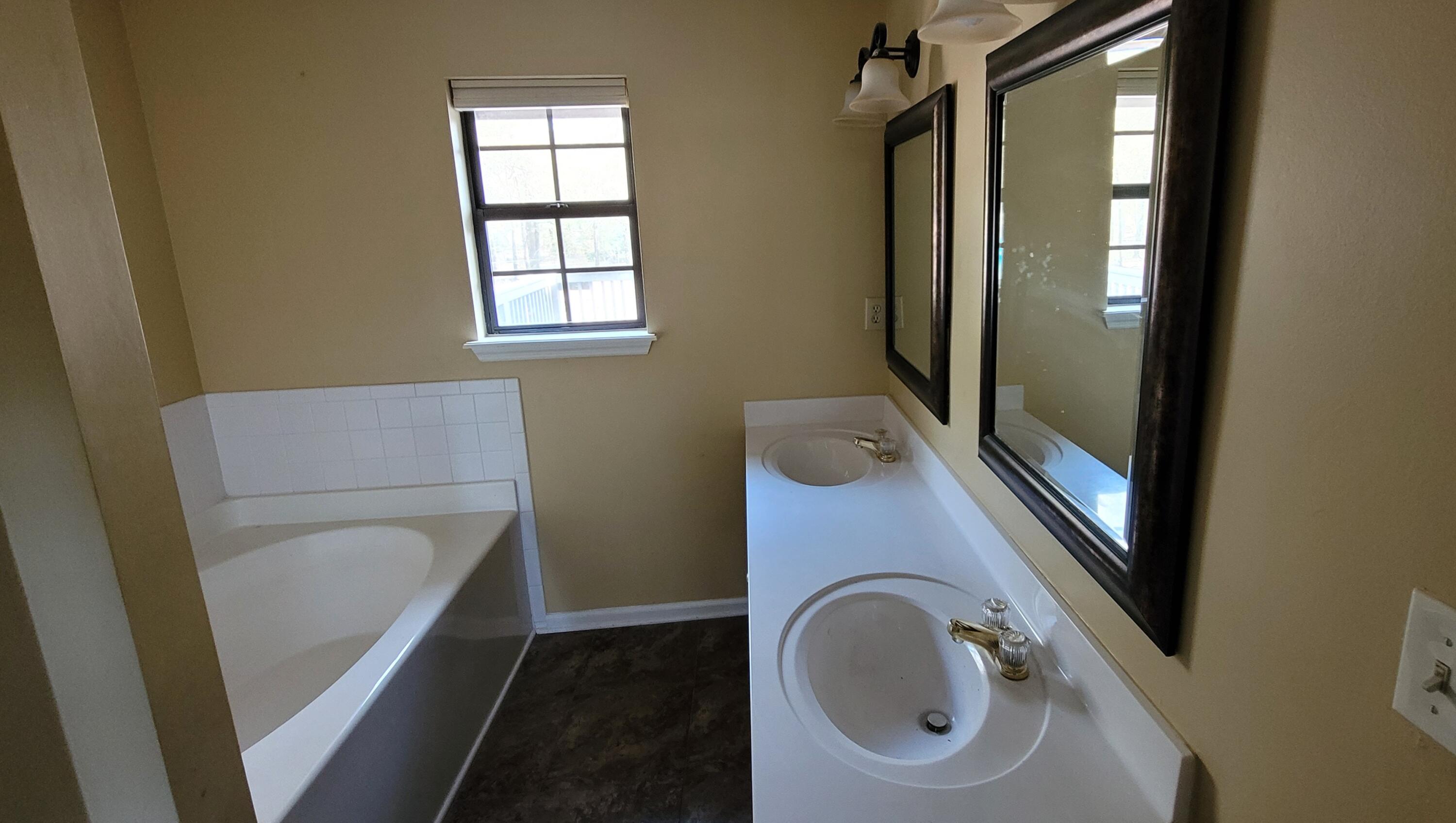 4314 Aintree Road Hephzibah, GA 30815 - Photo 9 of 16 master bathroom with double vanity, tub, shower