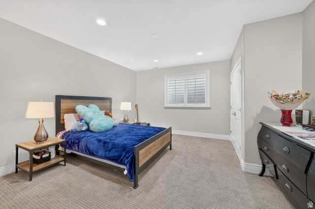 14738 Tangle Hill Road Herriman, UT 84096 - Photo 52 of 66 Carpeted room with recessed lighting and a window featuring white plantation shutters