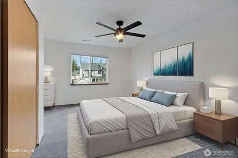 a bedroom with a large bed and a window