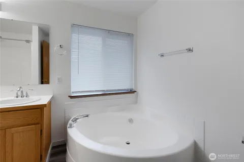 a bathroom with a white sink and a bathtub