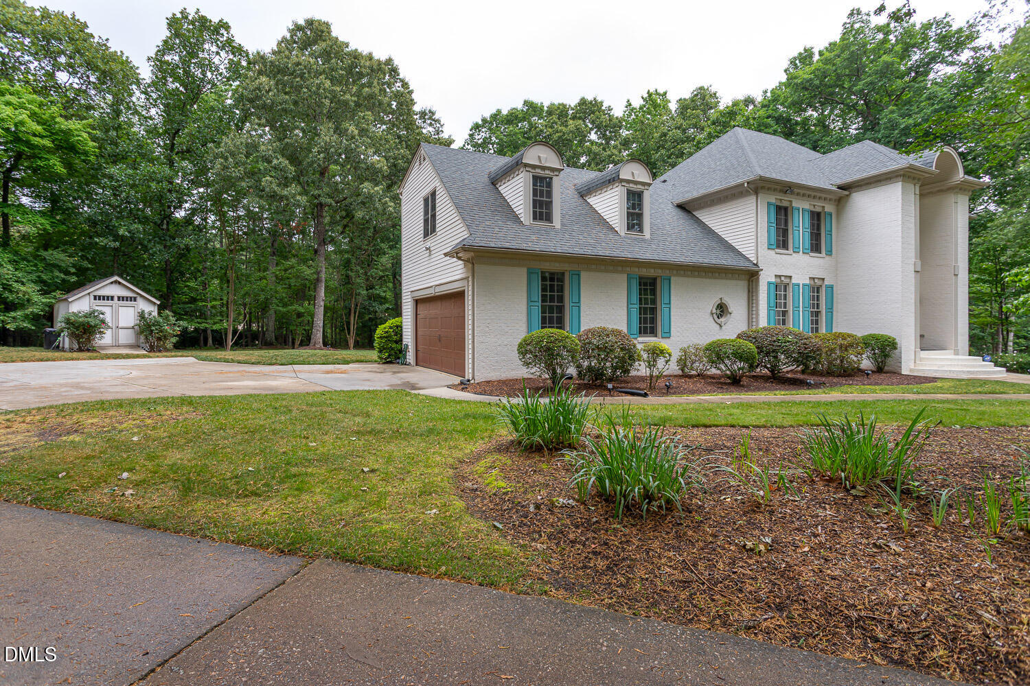 8509 Towneley Place Raleigh, NC 27615 - Photo 2 of 36 a front view of house with yard and green space