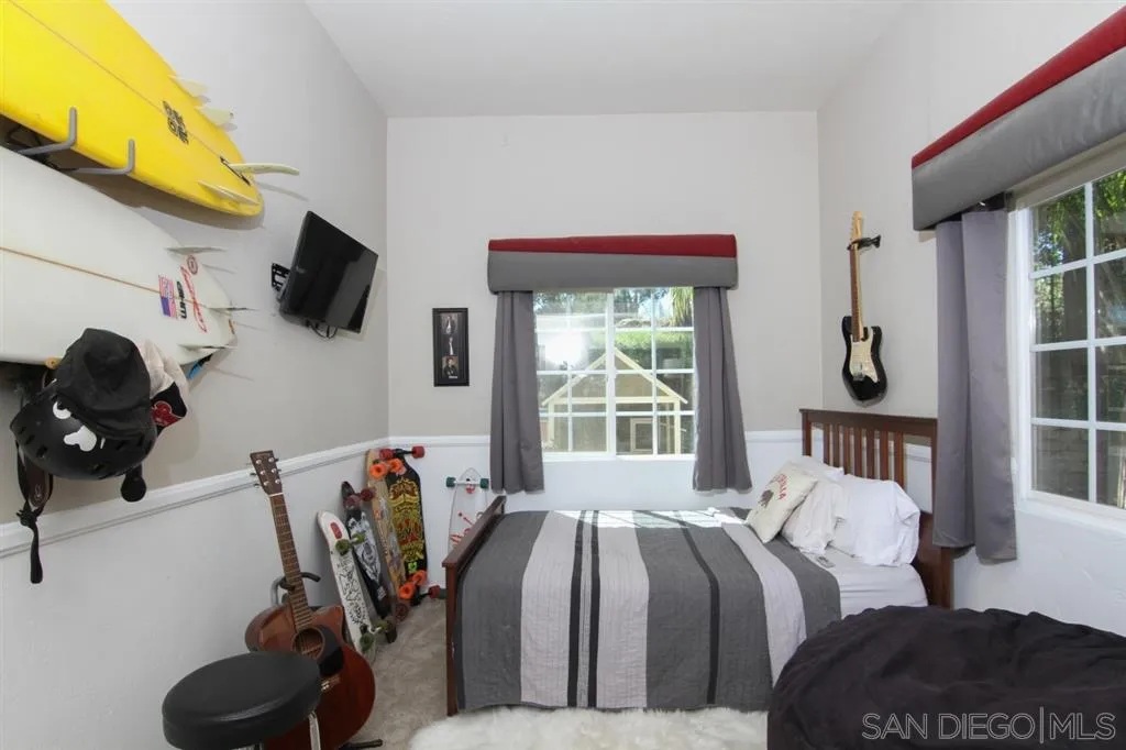 800 South Grade Road Alpine, CA 91901 - Photo 12 of 25 a bedroom with a bed a flat screen tv and a window