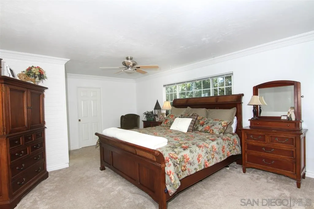 800 South Grade Road Alpine, CA 91901 - Photo 14 of 25 a bedroom with a bed and a dresser
