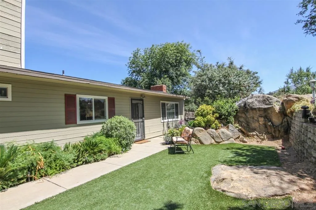 800 South Grade Road Alpine, CA 91901 - Photo 24 of 25 a view of a house with a backyard and a garden
