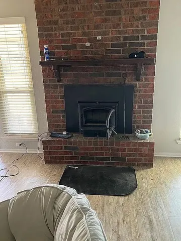 a view of kitchen with sink and window