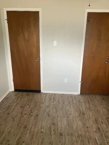 an empty room with wooden door