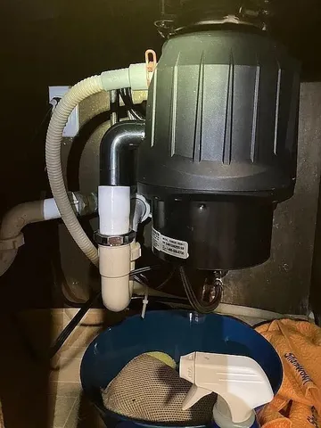 a bathroom with a toilet mirror and sink