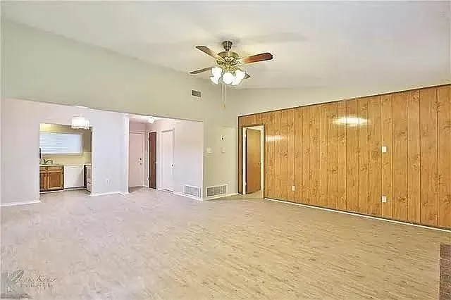 a view of an empty room with a window