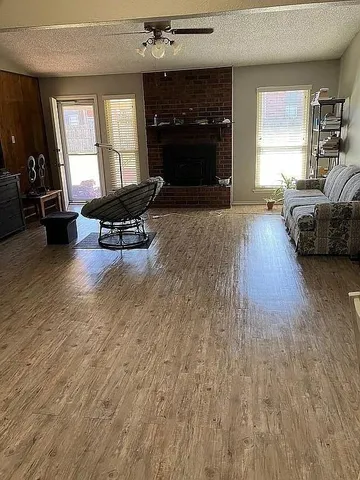 a living room with furniture and a fireplace