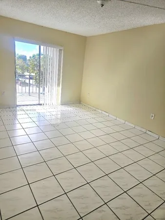 a bathroom with a sink a toilet a mirror and shower