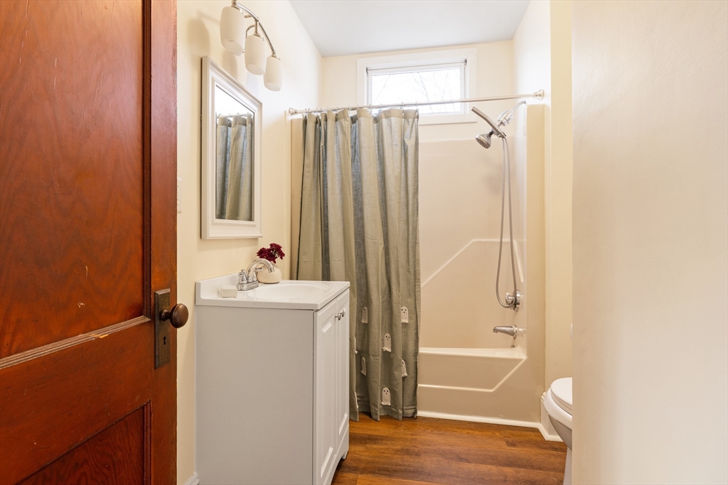 20 Marion Street Natick, MA 01760 - Photo 14 of 39 a bathroom with a shower a sink and a mirror