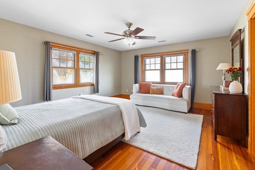 20 Marion Street Natick, MA 01760 - Photo 16 of 39 a bedroom with a bed and wooden floor