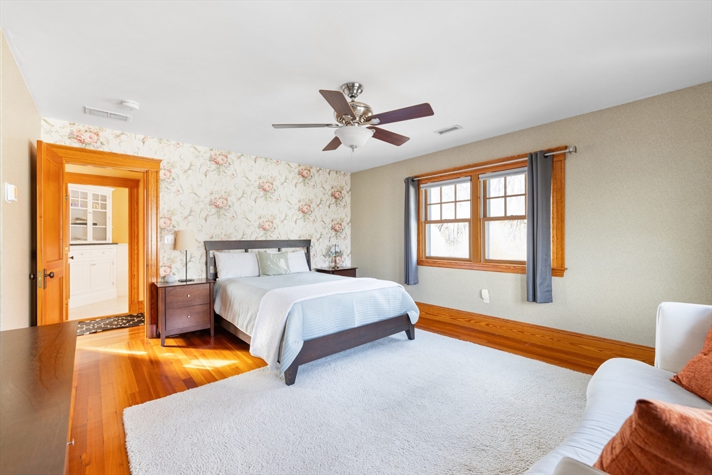 20 Marion Street Natick, MA 01760 - Photo 17 of 39 a bedroom with a bed and wooden floor