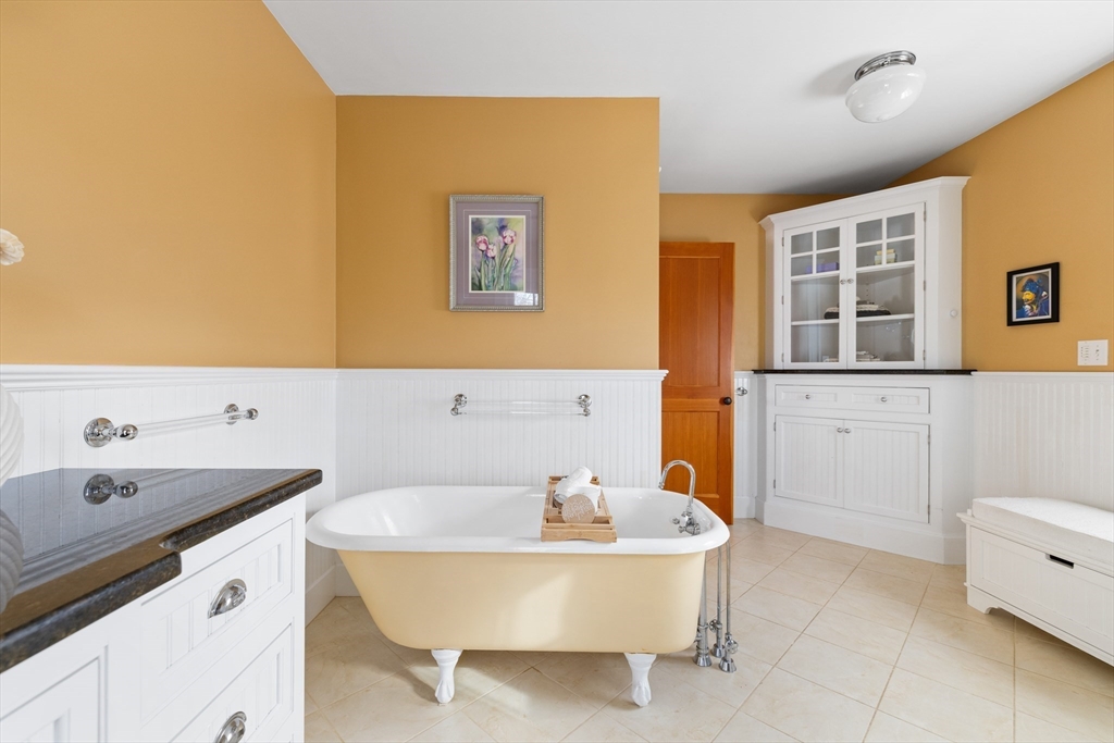20 Marion Street Natick, MA 01760 - Photo 26 of 39 a bathroom with a tub sink and mirror
