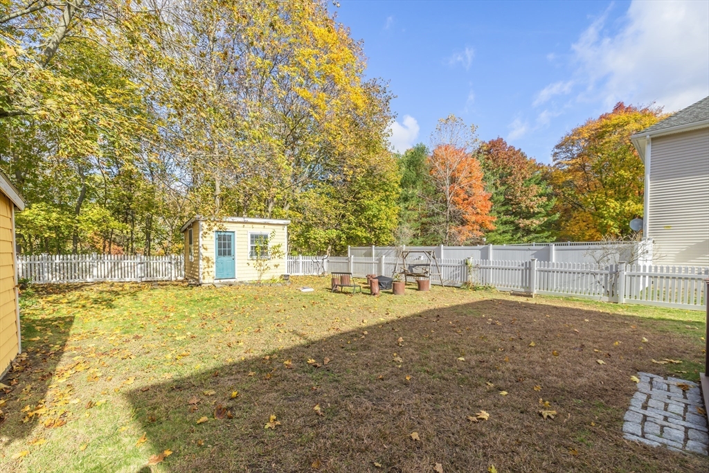 20 Marion Street Natick, MA 01760 - Photo 32 of 39 a backyard of a house with large trees