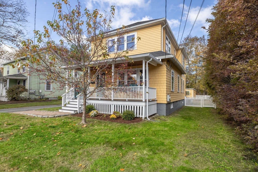 20 Marion Street Natick, MA 01760 - Photo 36 of 39 a front view of a house with a garden and deck