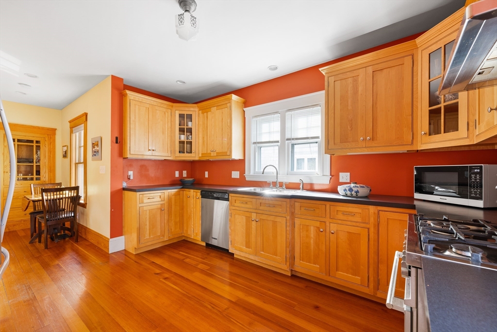 20 Marion Street Natick, MA 01760 - Photo 5 of 39 a kitchen with stainless steel appliances granite countertop a stove a sink and a refrigerator