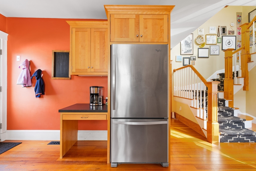 20 Marion Street Natick, MA 01760 - Photo 6 of 39 a kitchen with a refrigerator a stove and a wooden floor
