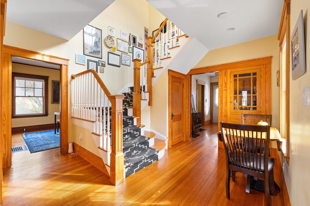 20 Marion Street Natick, MA 01760 - Photo 8 of 39 a view of a hallway with wooden floor and staircase