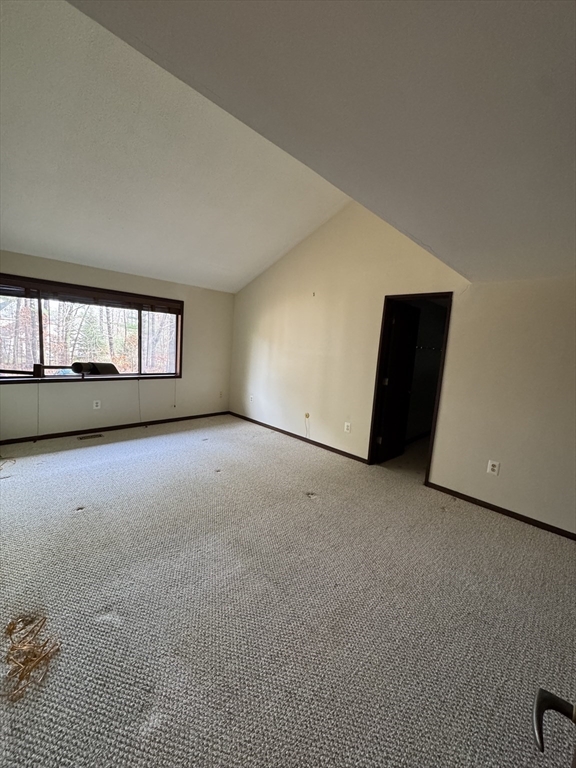 445 Old Stone Brook, Unit 445 Acton, MA 01718 - Photo 11 of 16 a view of an empty room with a window