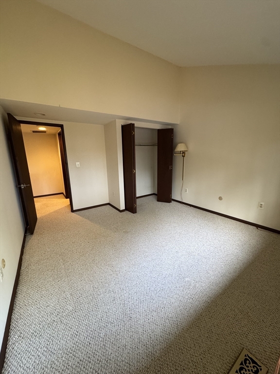 445 Old Stone Brook, Unit 445 Acton, MA 01718 - Photo 10 of 16 a view of an empty room and a window