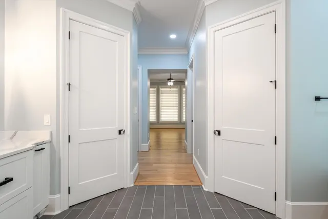 a room with a sink cabinets and window