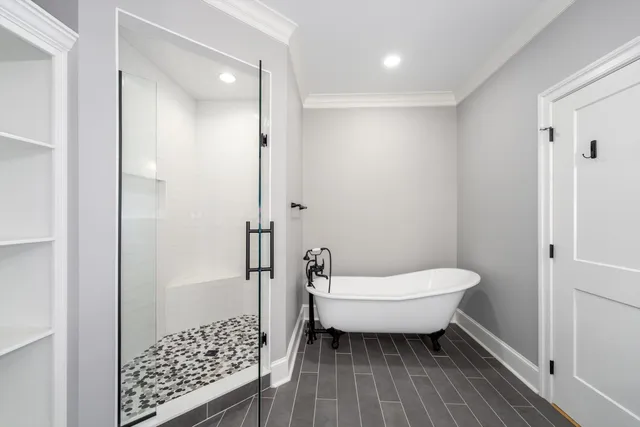 a bathroom with a sink a mirror and shower