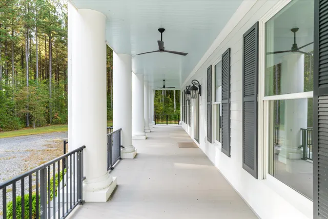 a view of an entryway with a floor to ceiling window and stairs