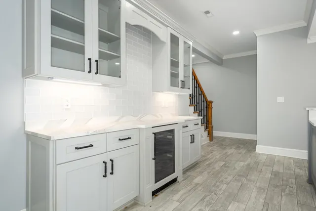 a street sign on a sidewalk next to a road